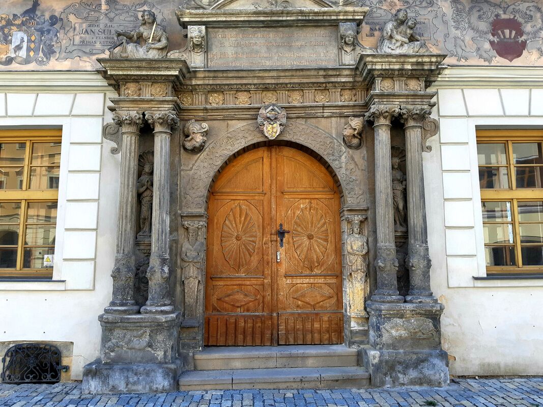 The Mayor's residence with a beautifully carved leaning door.