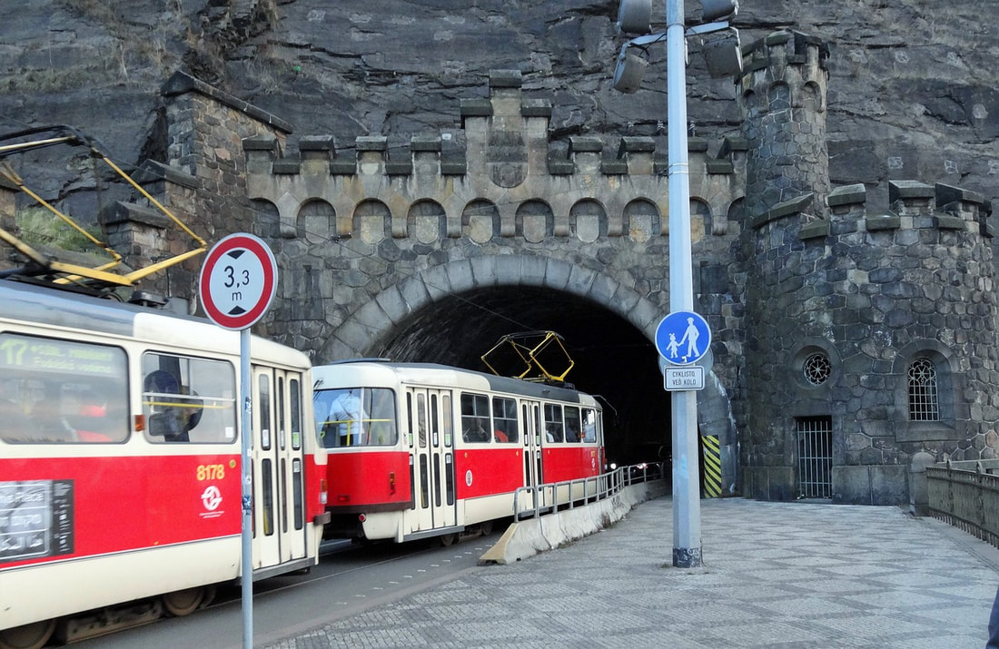 Tram passing through an archway. Photo courtesy of Evada at Pixabay.